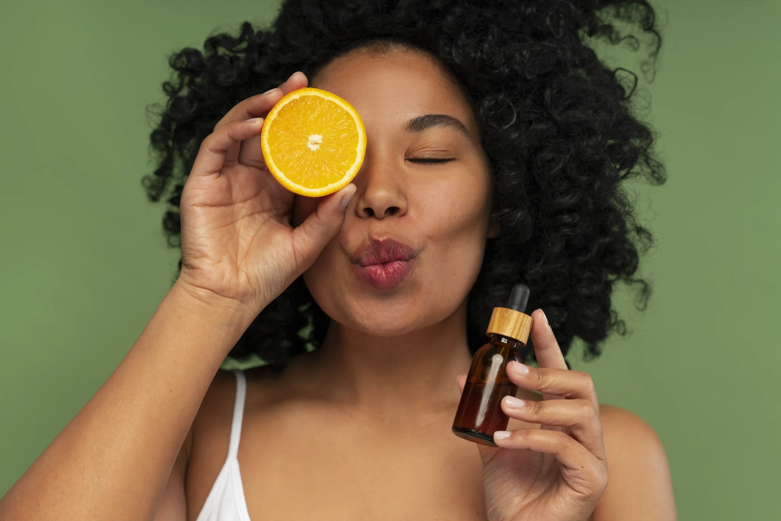 Best Vitamin C Serum for Face in Nigeria: The Ultimate Guide for Beginners 2 portrait young beautiful woman with citrus vitamin c serum scaled